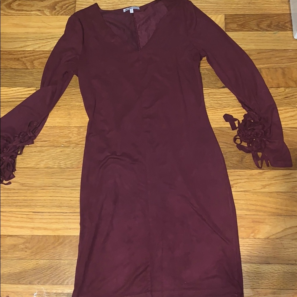 A purple dress with/ fringe sleeves
